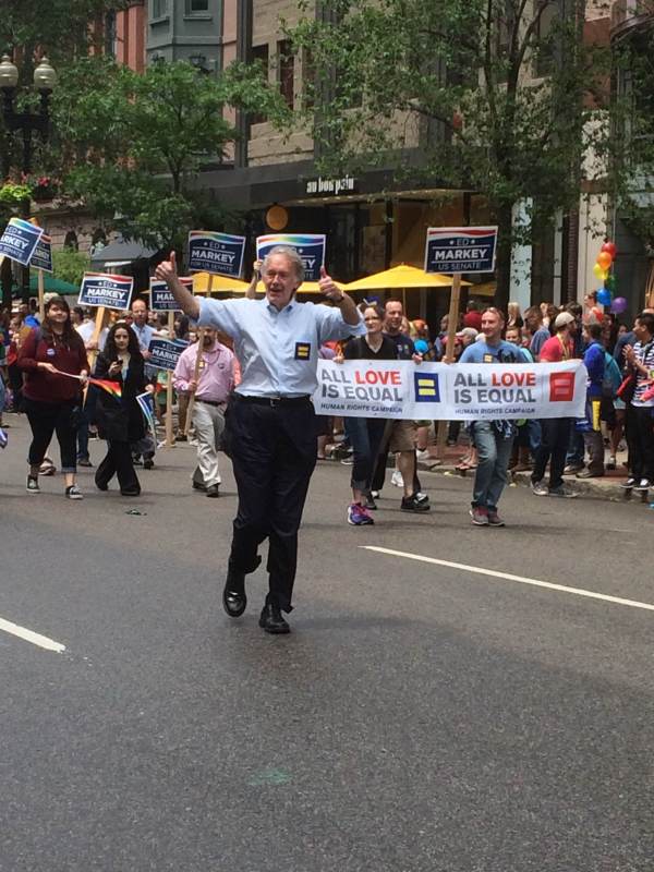 U.S. Senator Ed Markey waves to parade spectators on Boylston Street in Boston